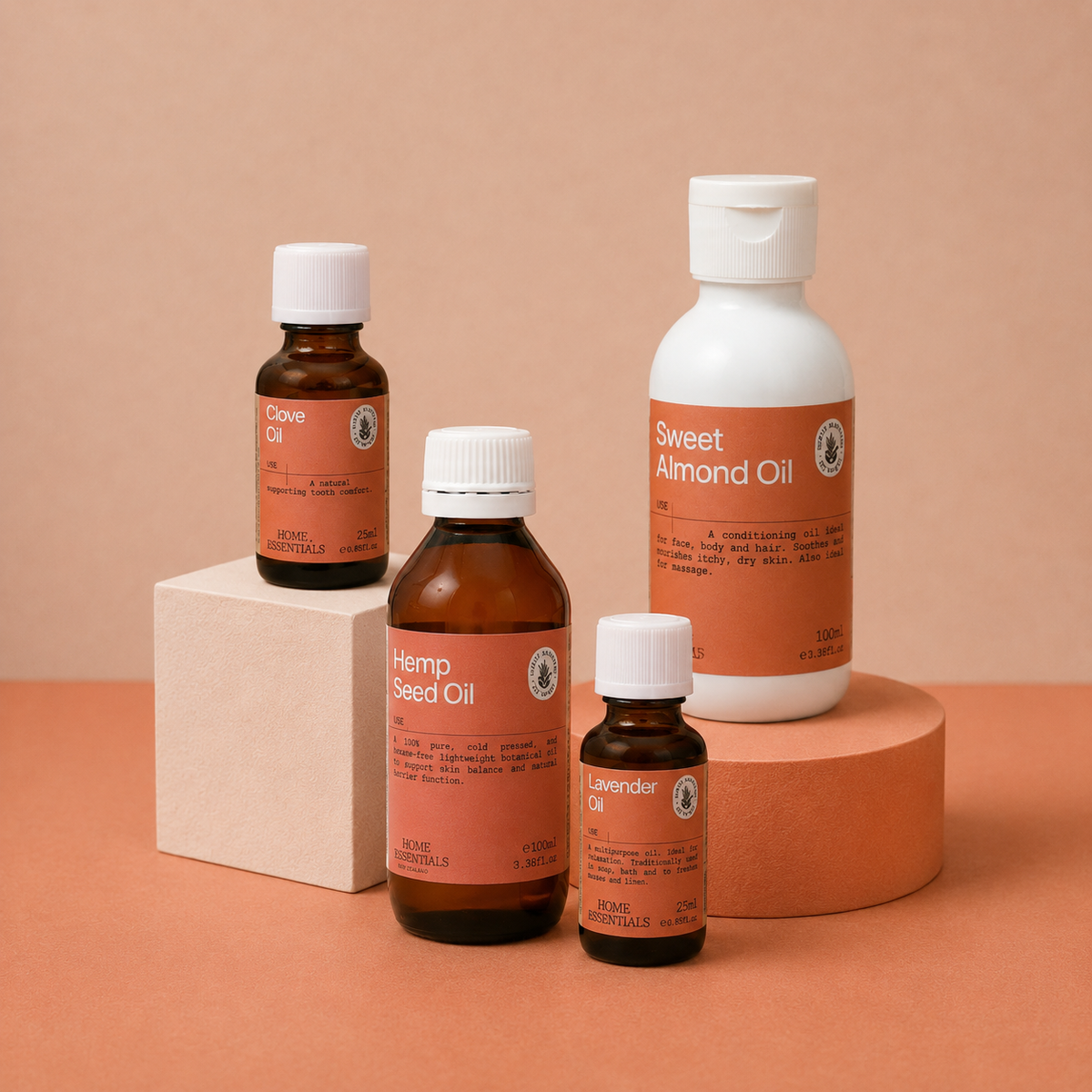 Carrier oils and essential oils grouped on a terracotta background