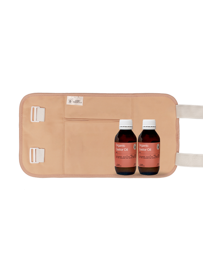 Two 100ml bottles of Organic Castor Oil placed in front of the beige multicare wrap, to show the bundle content.