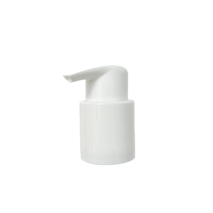 Pump dispenser head on white background, showing the nozzle and screw cap