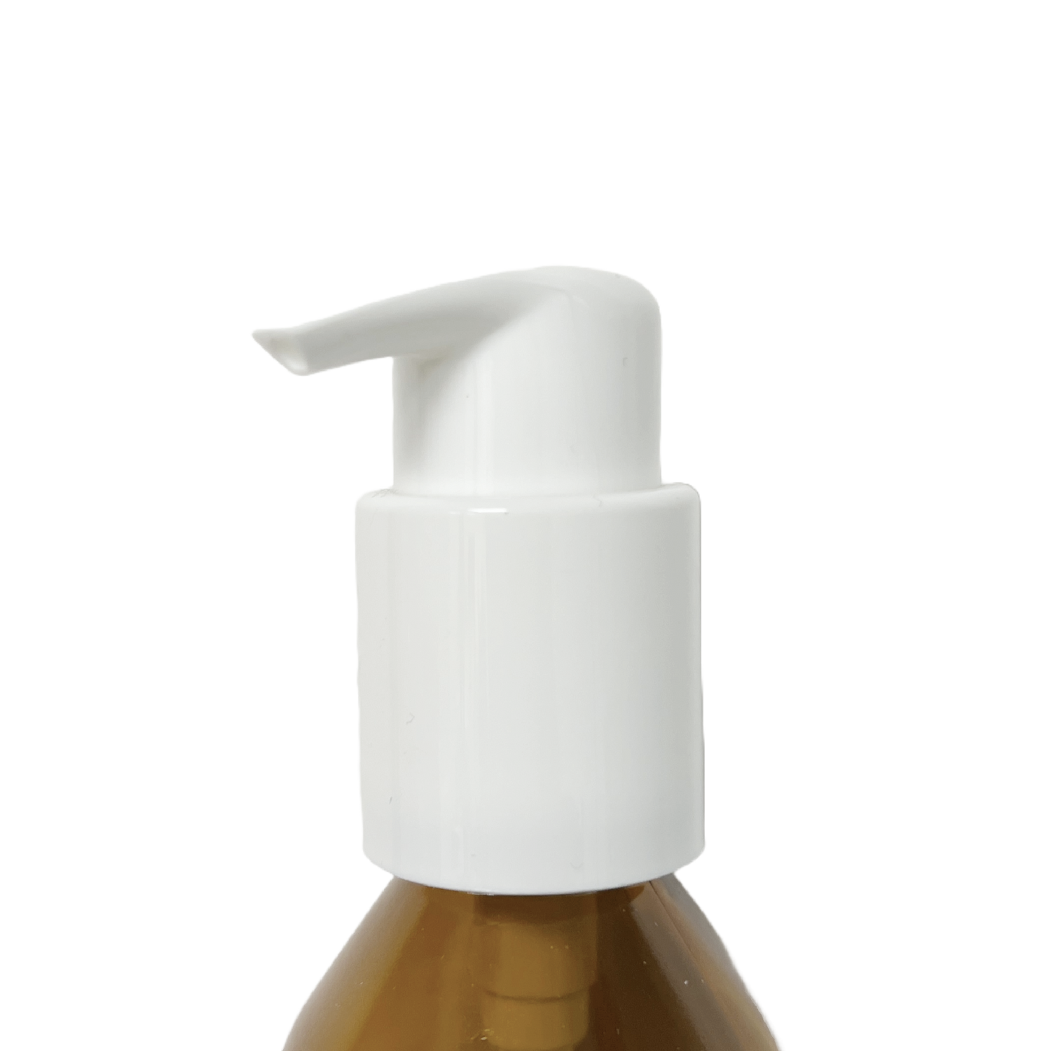 Pump dispenser head fitted onto an amber glass bottle, close-up view